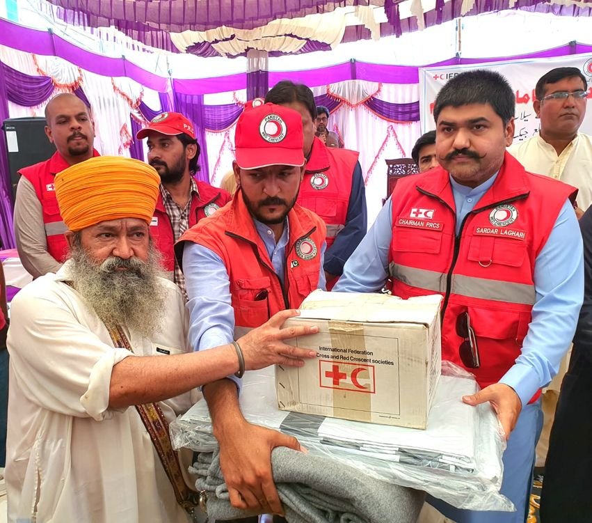 Chairman PRCS distributing relief items to flood affected people
